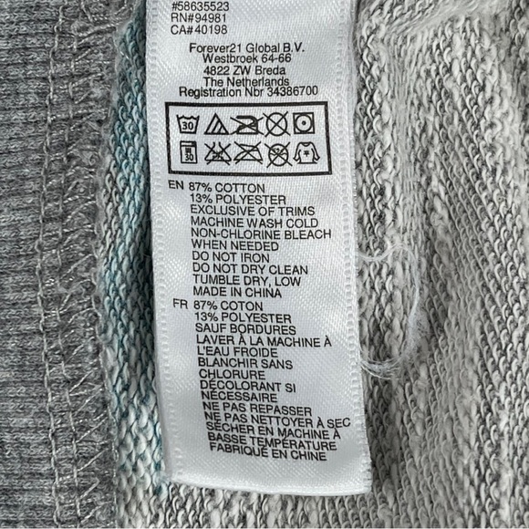 Forever 21 size medium cropped grey sweatshirt with colorful Aztec tribal design - Picture 16 of 16